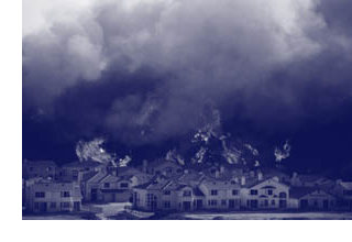 Photograph of a wide-scale residential fire warranting evacuation.