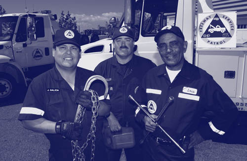 Photograph of Freeway Service Patrol tow drivers Jessie Galicia, Larry Miller, and Louis Ray pose with tools of their trade.