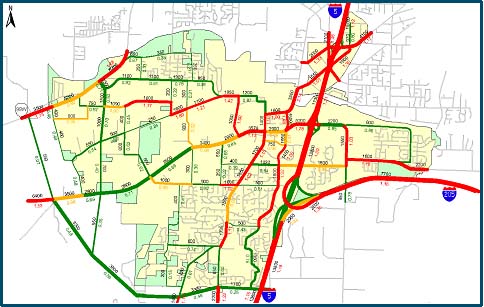 map depicting the link volumes of the major roadways in the City of Tualatin. The volumes are color coded with higher volumes in red and low volumes in green. The figure also shows v/c ratio below the roadways.