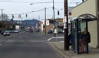 photograph of a bus stop at an intersection along one of the arterials studied in Portland, Oregon, to determine the effects of transit priority for signals along the corridor