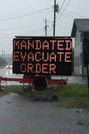 A sign that says Mandated Evacuate Order