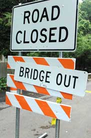 Photo of a sign that says Road Closed, Bridge Out