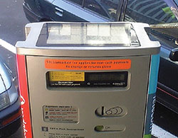 Photo. A close up of a sticker purchase machine, which drivers may use to purchase sticker permits.