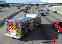 An emergency vehicle being parked in such a way as to protect incident responders and secure the scene before more permanent traffic control devices arrive.