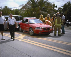 Incident responders working together at a crash scene.