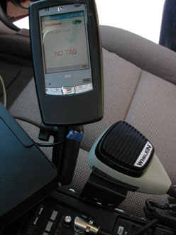 Photo showing the technology associated with the MnPASS I-394 HOT lanes.  The in-vehicle display indicating the tag status of any vehicle passing the patrol vehicle.