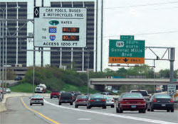 Photo. Example of Minnesota's dynamically priced high occupancy toll lanes. The current MnPass rates are shown on a sign above the HOT lane.