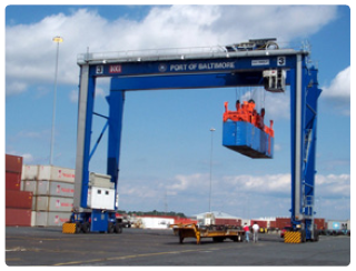 Photo of a sea port gantry crane moving a freight container at the port of Baltimore.