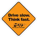 A caution sign that has the MDT logo and reads, Drive slow. Think fast. 