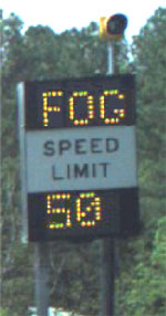 Photo of a variable message sign that reads, Fog, speed limit fifty.