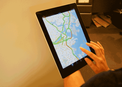 A picture of a tablet computer showing roadways with colors highlighting the current speeds.