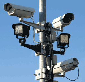 Highway monitors and cameras on a poll.