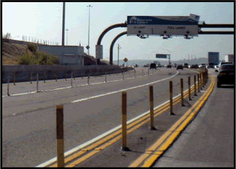 A photograph showing individual pylon separating lanes on interstate section.
