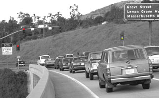 Photo of congestion at a highway entrance ramp meter.