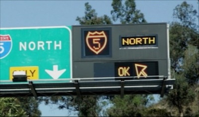Active Traffic Management signage for dynamic junction control, showing that the lane adjacent to the exit only lane may also be used to exit to I-5 north.