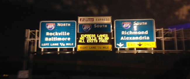 Photo of overhead highway signage indicating that the E-ZPass Express lane is not requiring a toll.