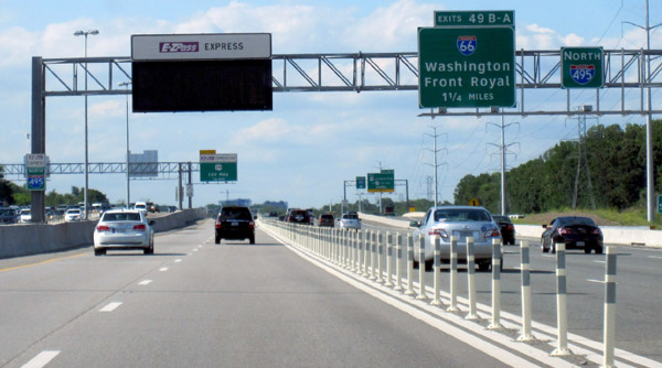 Photo of  I-495 Express Lanes on the Capital Beltway in Fairfax County, VA, near Washington, DC. the two left-hand managed lanes feature a plastic post barrier and overhead variable message signs.