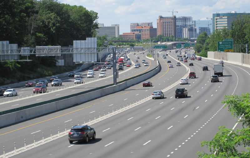 Photo of the I-495 Express Lanes separated from the publicly owned and heavily congested general purpose lanes by a 4 foot buffer with a plastic post barrier. In both directions of travel, vehicle congestion is far greater in the general purpose lanes.