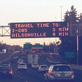 [photo 5]. This photo shows a dynamic message sign with estimated travel times to I-205 and Wilsonville.