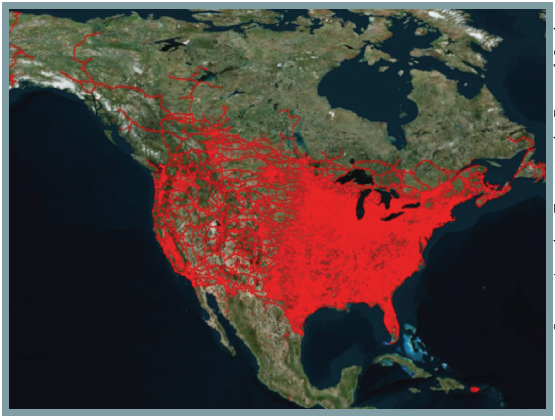 Enhanced satellite image of north america with ATRI truck routes in red. The eastern half of the country is nearly all solid red, whereas the western half has moe distinct lines tracing the various routes, although California and most of the upper northwest areas show patches of solid red along the coasts and near the more populated areas.