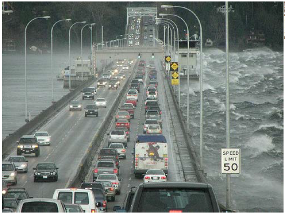 Photo of the existing SR 520 Bridge in Washington during rush hour conditions and heavy weather.