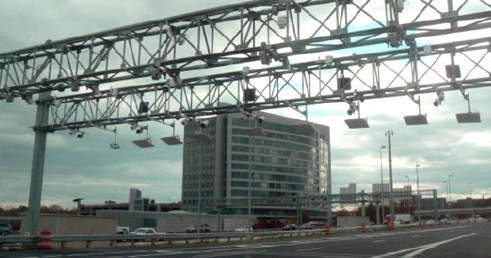 Video and transponder detection devices mounted on an overhead gantry.