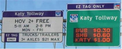 Signs advise drivers as to fees and use restrictions on the Katy Tollway.