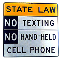 Warning sign reads: State Law, No Texting, No Hand Held Cell Phone.