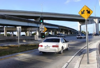 The image shows a car at the stop bar of ramp meter.