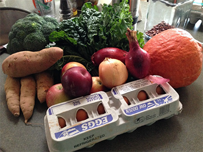 photo of fresh produce and a carton of eggs