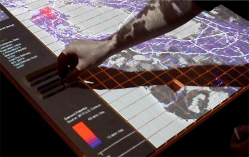 photo of a person interacting with a tactile map interface