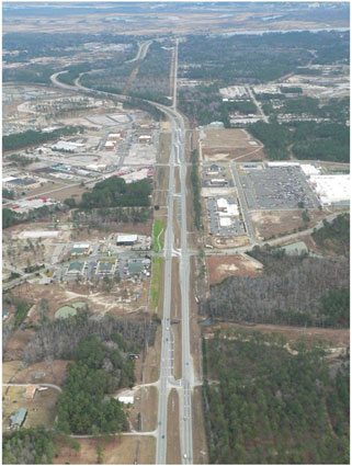 Figure 17 is a photo of a Restricted Crossing U-Turn (RCUT) intersection corridor that has been deployed along U.S. Route 17 in Brunswick County, North Carolina.