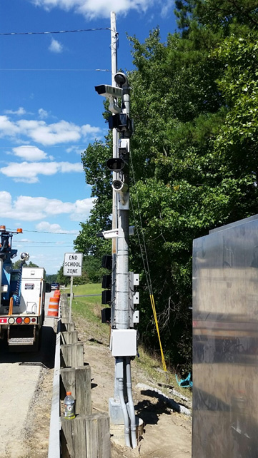 Figure 7 is a photograph showing installation of technology at the Laurel County Kentucky virtual weigh station.