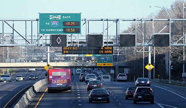 Figure 15. Photo showing a gantry with highway signs marking HOV and general purpose lanes.