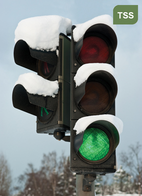 Photograph of a traffic signal topped with snow identifying with the Traffic Signal Systems Management CMF. (Credit: eans/Shutterstock)