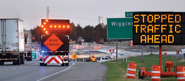 freeway work zone with various identifying and warning signage (Credit: TTI Communications)