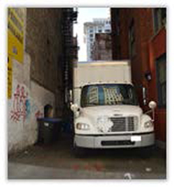 a freight truck parked in a Seattle alley