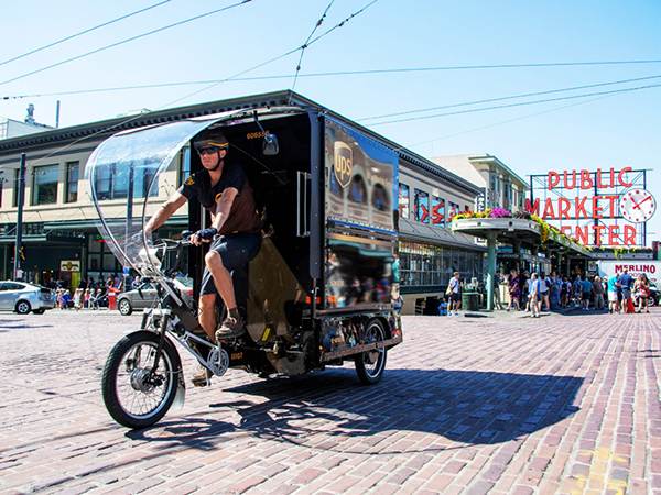 a rider pedaling a UPS e-trike