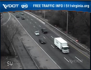 Photo shows Virginia DOT CCTV feed where cars and a truck are driving down a road.