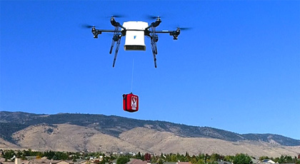 Figure 9 is a photo of a drone in the sky with a package delivery.