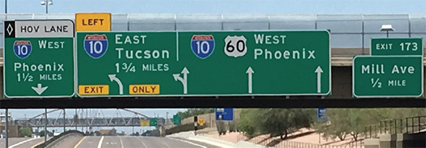 Image of road signs on overpass along I-10 in Arizona.