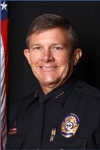 A headshot of Chief Daniel G. Sharp.