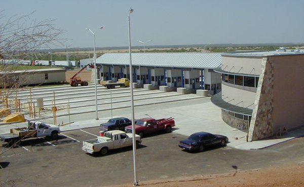 A photograph of a set of toll booths on a highway.