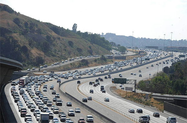 The SR 91 Freeway in Orange County, California with a set of two-lane managed lanes the operate in the freeway median.