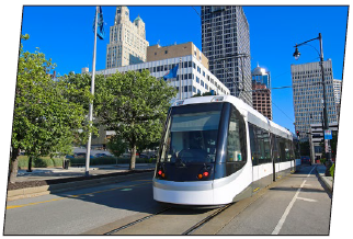 A light-rail trolley in an urban area.