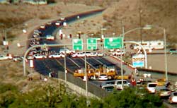 photo showing police cruisers and highway maintenance vehicles blocking Nevada State Route 168 at the Nevada-Arizona border