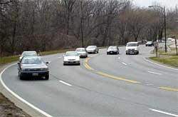 photo showing traffic traversing a four-lane arterial in one direction