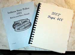photo of two special event implementation plan reports: "Indiana State Police 2002 Brickyard Race Detail" and "2002 Pepsi 400"