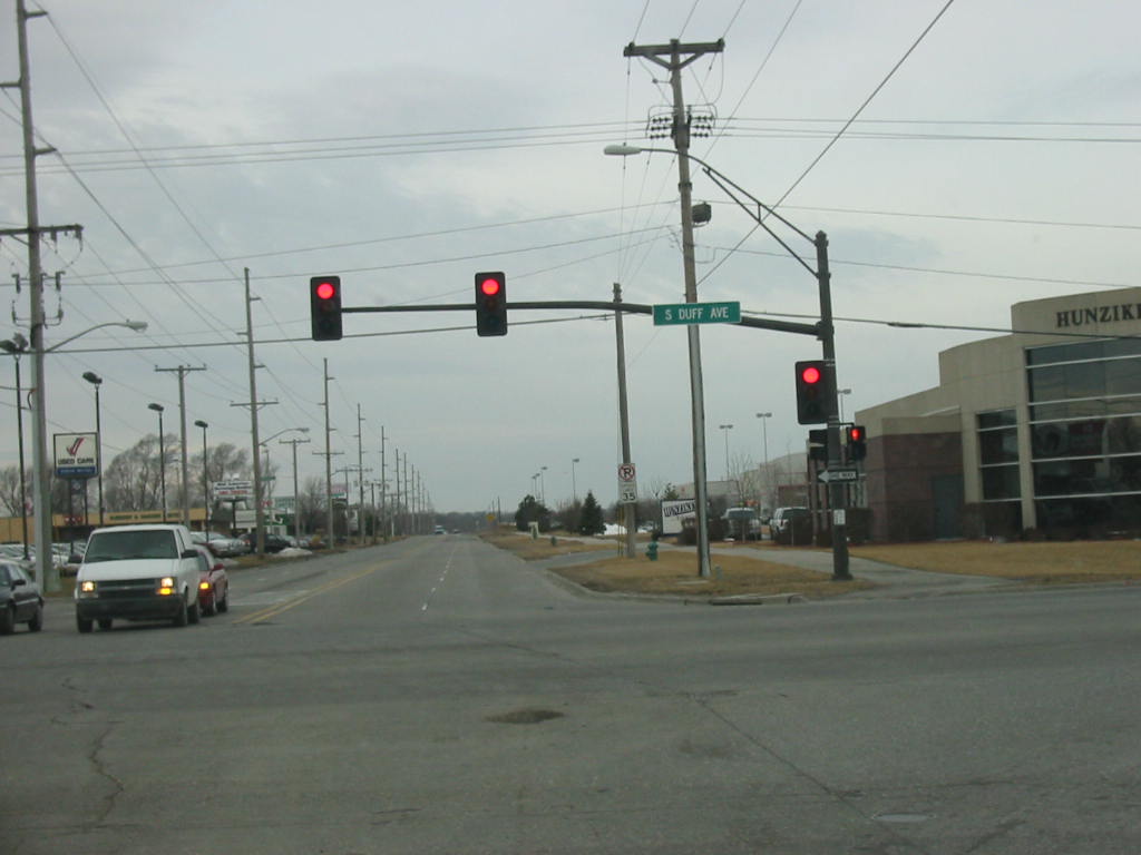 photo of two overhead traffic signals at intersection