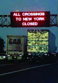 Photograph of dynamic message sign advising travelers that all crossings to New York were closed on September 11, 2001